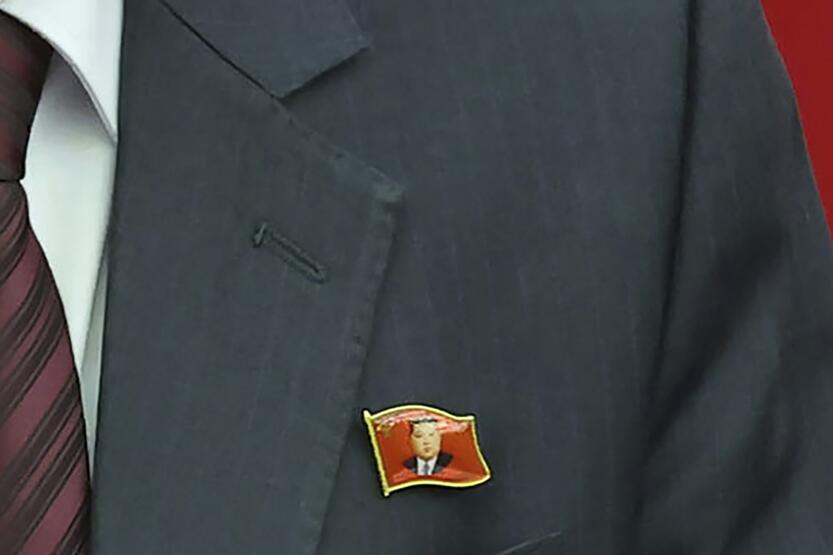 Ženkliukas su Kim Jong Uno atvaizdu.