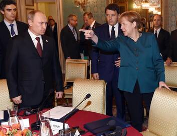 Vladimiras Putinas ir Angela Merkel