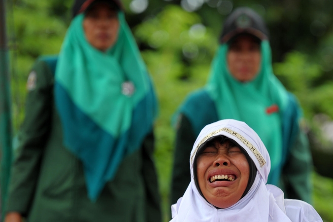 Indonezijoje už islamo įstatymų pažeidimą nuplakta jauna moteris